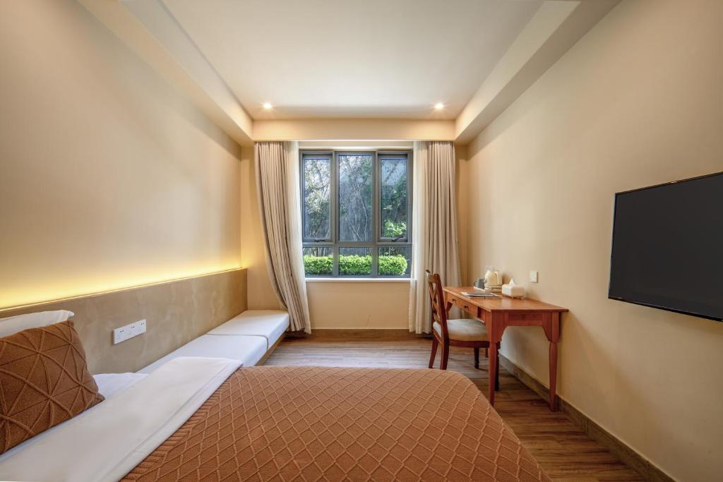 Postel nebo postele na pokoji v ubytování Hangzhou West Lake Youshan Villa