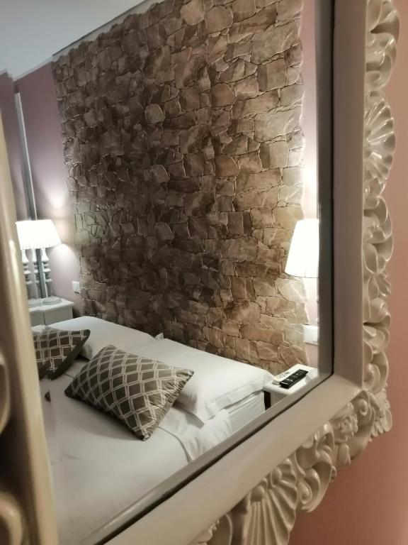 Postel nebo postele na pokoji v ubytování Eneide