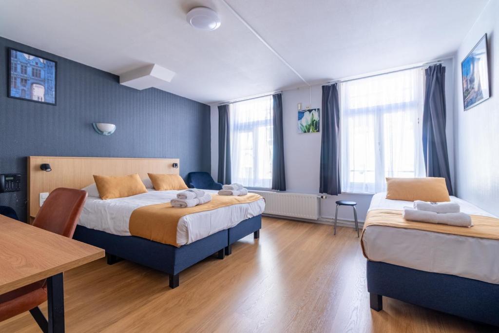 Postel nebo postele na pokoji v ubytování Hotel Montovani