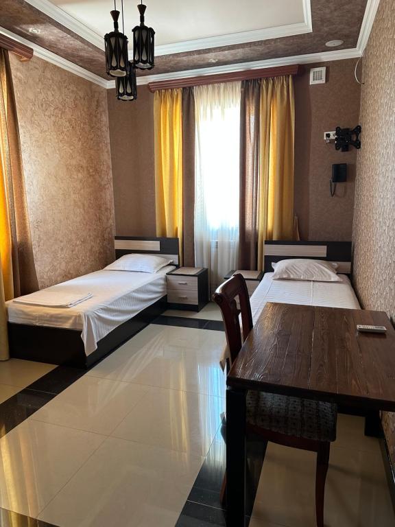 Postel nebo postele na pokoji v ubytování KangAr guest house