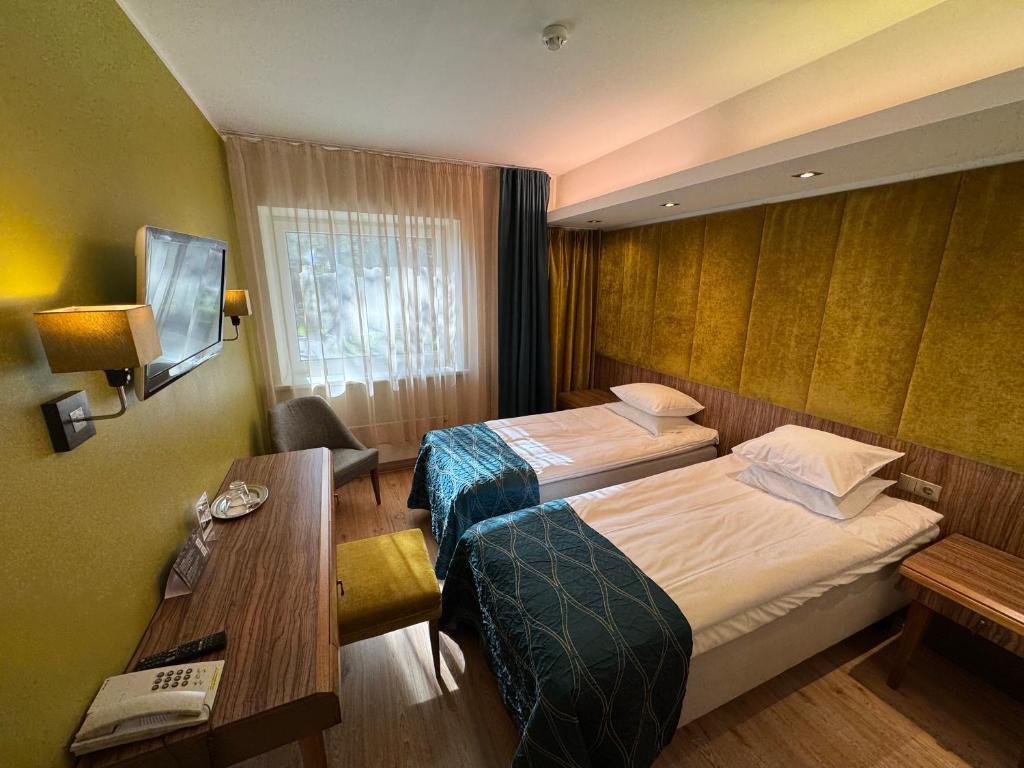 Postel nebo postele na pokoji v ubytování Fra Mare Thalasso Spa