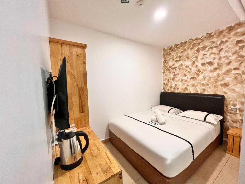 Postel nebo postele na pokoji v ubytování Seeds Hotel Putrajaya