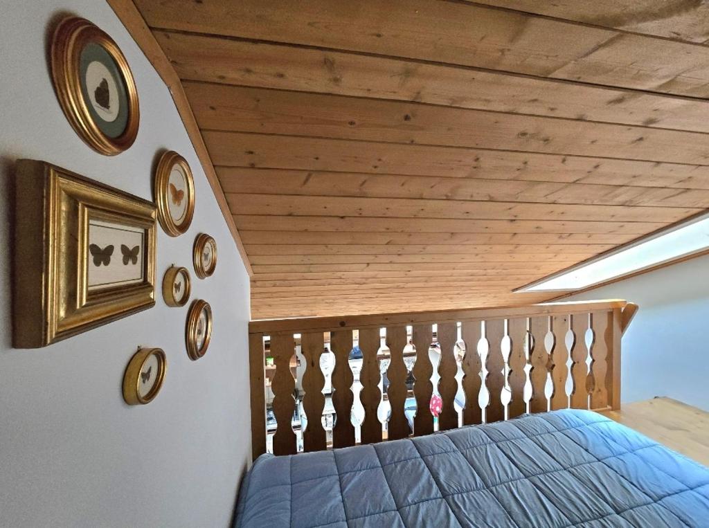 Postel nebo postele na pokoji v ubytování Appartamento Latemar Predazzo