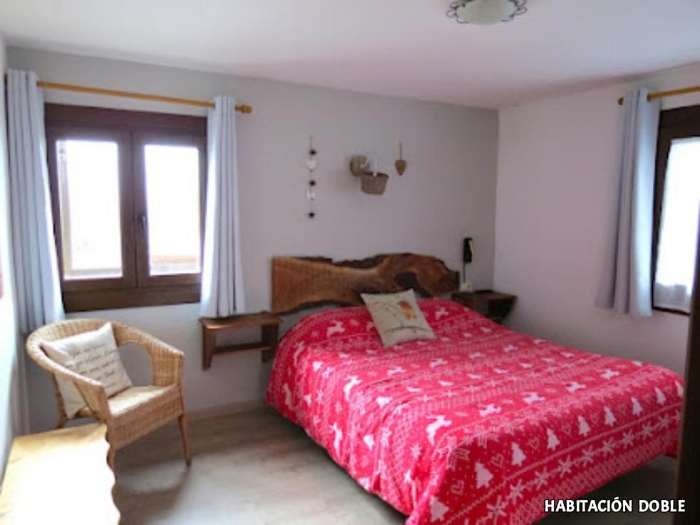 Postel nebo postele na pokoji v ubytování Hostal Rural Sant Climent