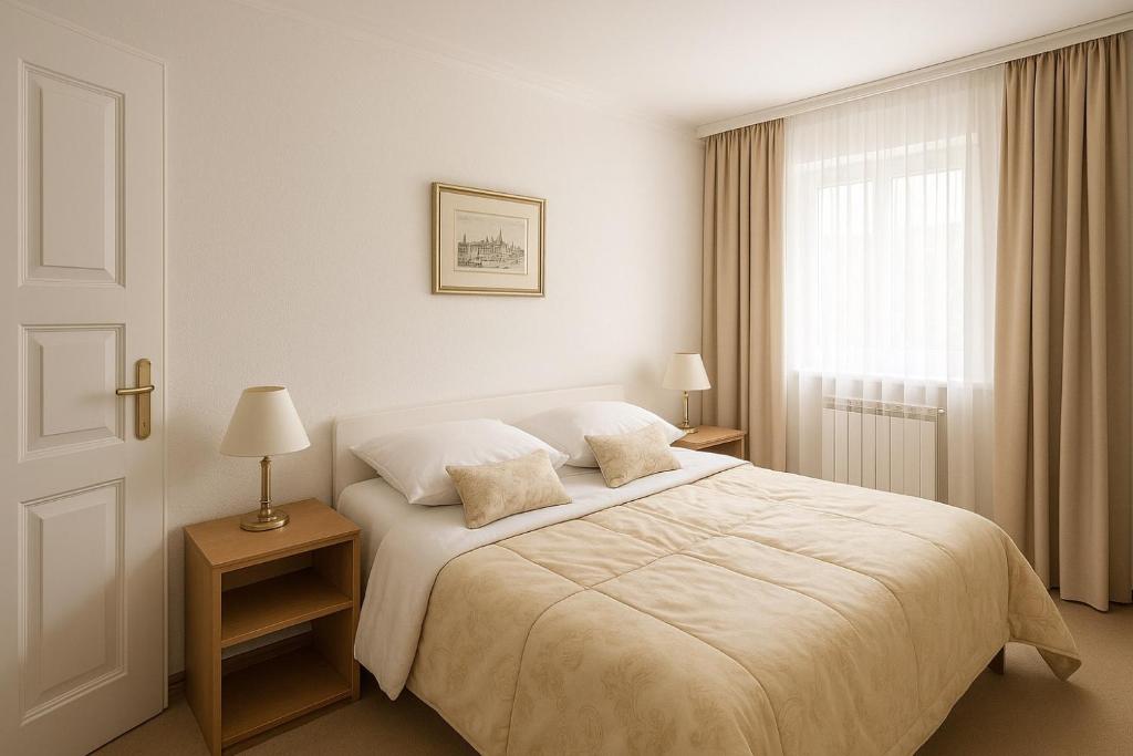 a bedroom with a white bed and a window at Apartments Jezerce 28 in Jezerce