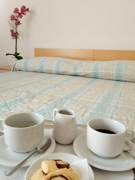 Postel nebo postele na pokoji v ubytování Hotel Gigliola