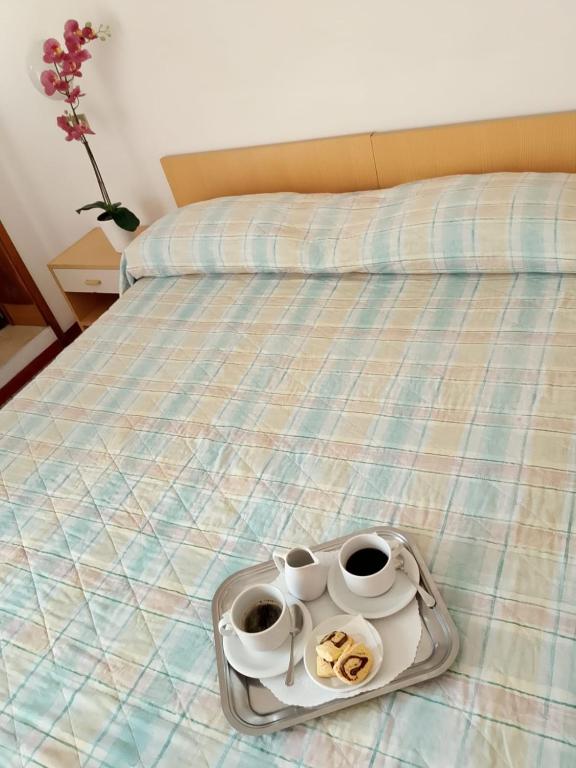 Postel nebo postele na pokoji v ubytování Hotel Gigliola