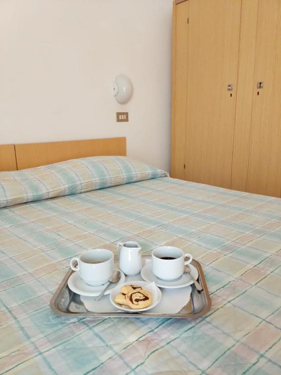 Postel nebo postele na pokoji v ubytování Hotel Gigliola