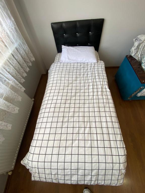 Postel nebo postele na pokoji v ubytování EylülSuites
