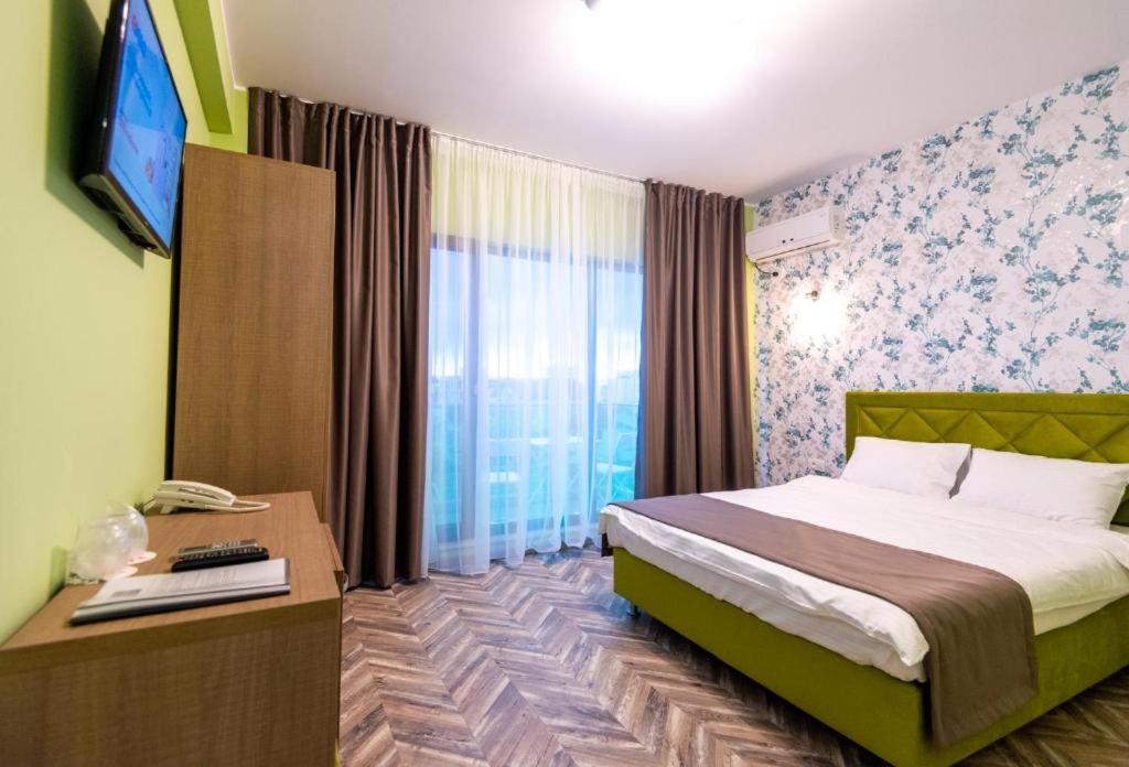 Postel nebo postele na pokoji v ubytování Friday Hotel