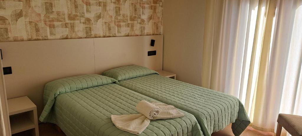 Postel nebo postele na pokoji v ubytování Garnì Casa Rabagno