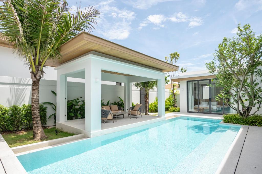 an image of a swimming pool in a villa at Mouana Breeze Mai Khao 4-bedroom Pool Villa 9925 in Mai Khao Beach