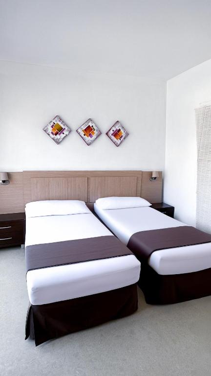 Postel nebo postele na pokoji v ubytování Hotel Primavera