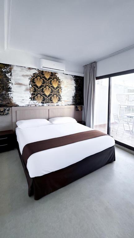 Postel nebo postele na pokoji v ubytování Hotel Primavera