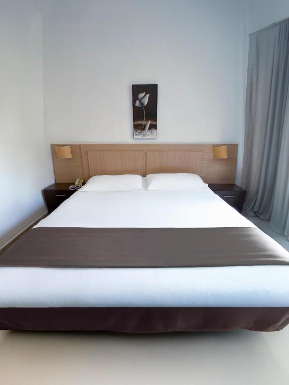 Postel nebo postele na pokoji v ubytování Hotel Primavera