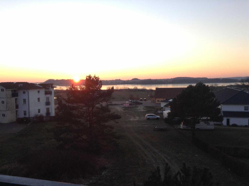 a sunset view from the balcony of a building at Haus Bellevue Wohnung 22 in Ostseebad Sellin