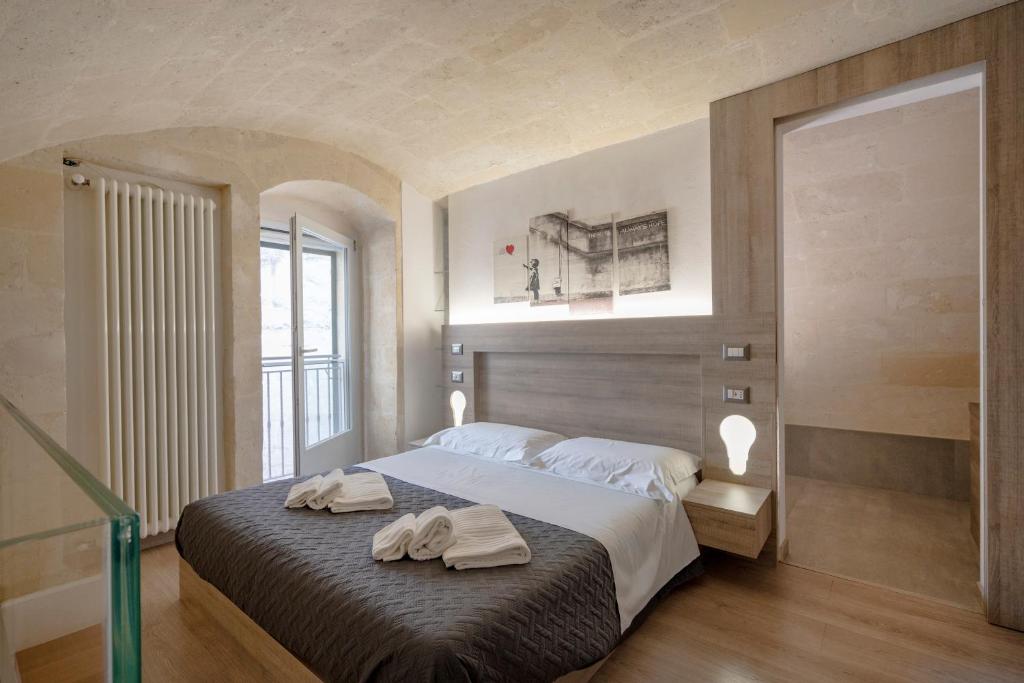 Postel nebo postele na pokoji v ubytování Angolo Nascosto