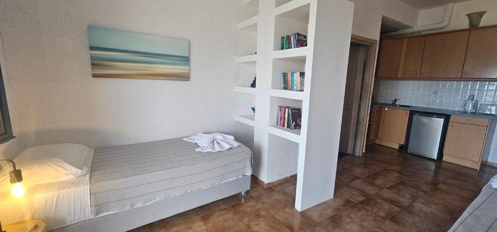 Postel nebo postele na pokoji v ubytování Metaxatos Apartments