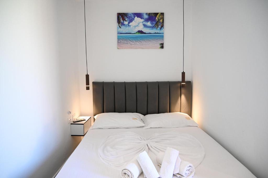 Uma cama ou camas num quarto em Hotel Vila AARON