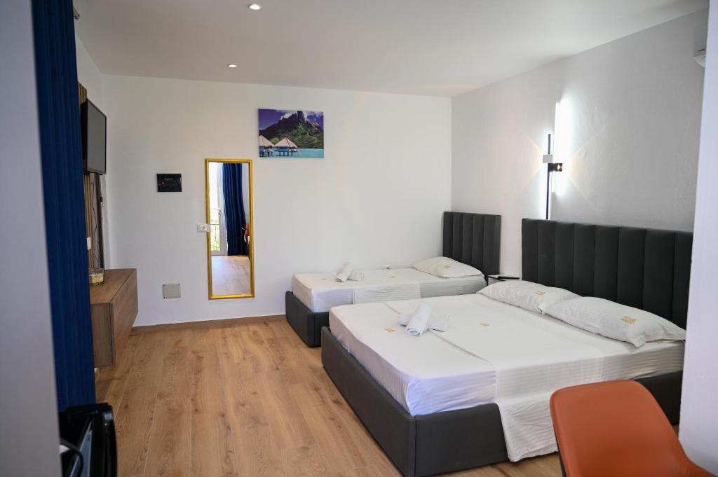 Uma cama ou camas num quarto em Hotel Vila AARON
