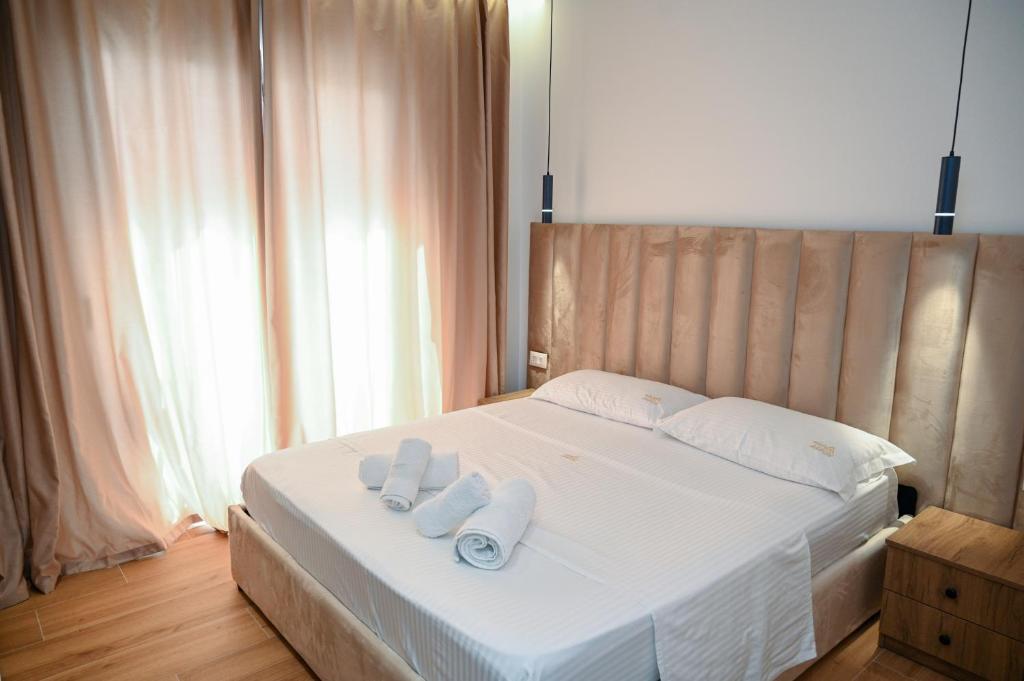 Uma cama ou camas num quarto em Hotel Vila AARON