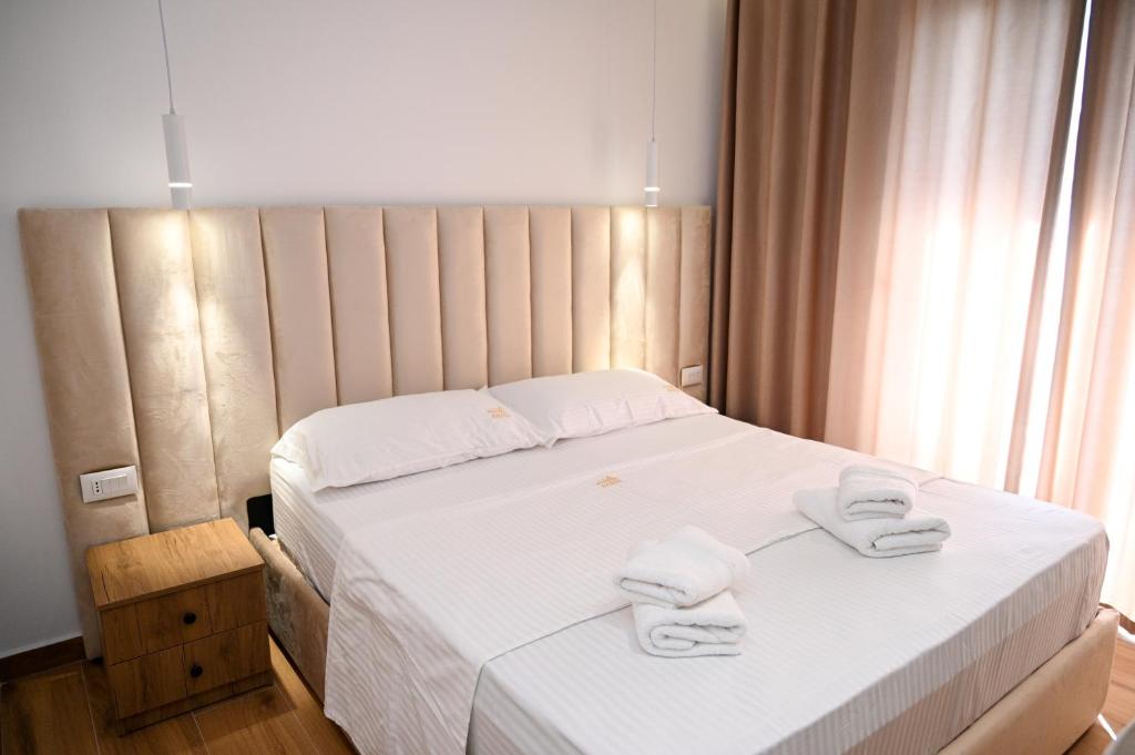 Uma cama ou camas num quarto em Hotel Vila AARON