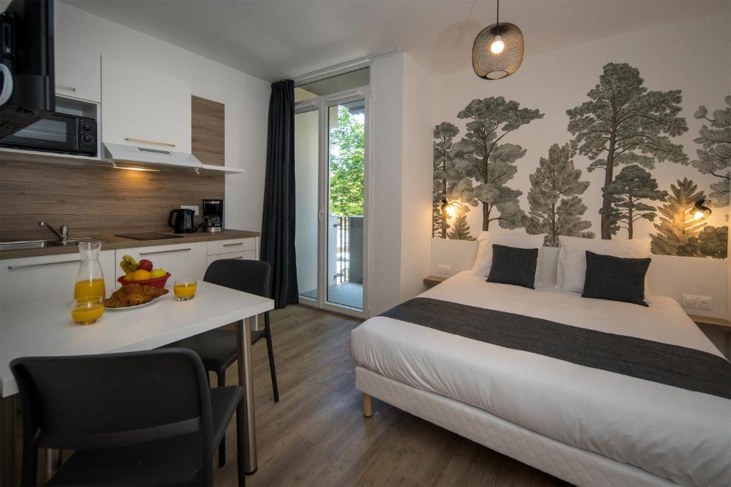 Postel nebo postele na pokoji v ubytování Lagrange Apart Hôtel Mulhouse Saint Sauveur