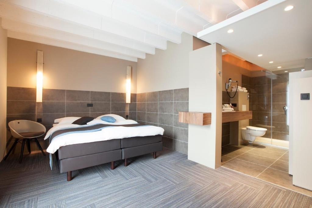 Postel nebo postele na pokoji v ubytování Hotel Vé