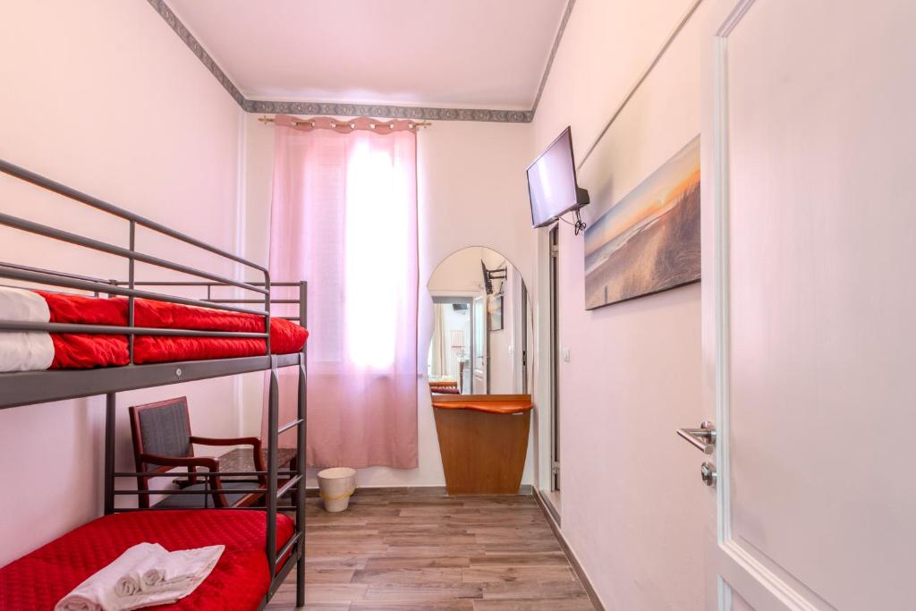 Postel nebo postele na pokoji v ubytování Hotel Corallo Follonica