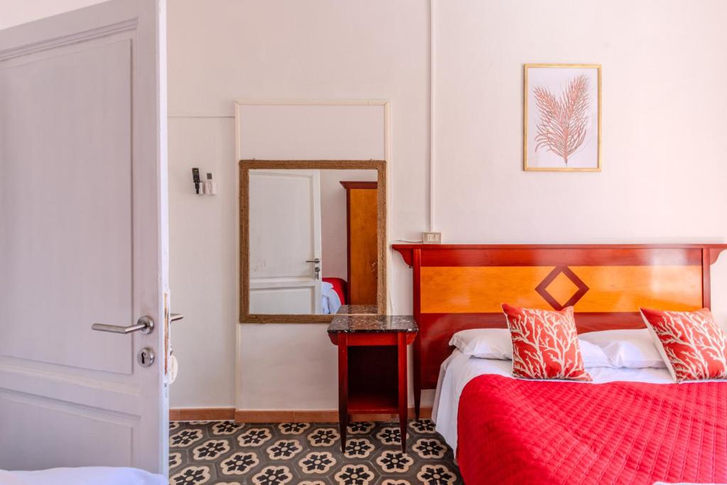 Postel nebo postele na pokoji v ubytování Hotel Corallo Follonica