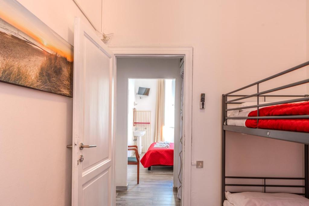 Postel nebo postele na pokoji v ubytování Hotel Corallo Follonica