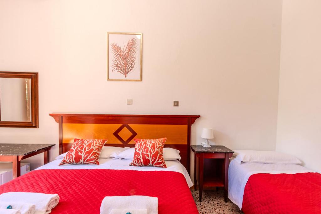 Postel nebo postele na pokoji v ubytování Hotel Corallo Follonica