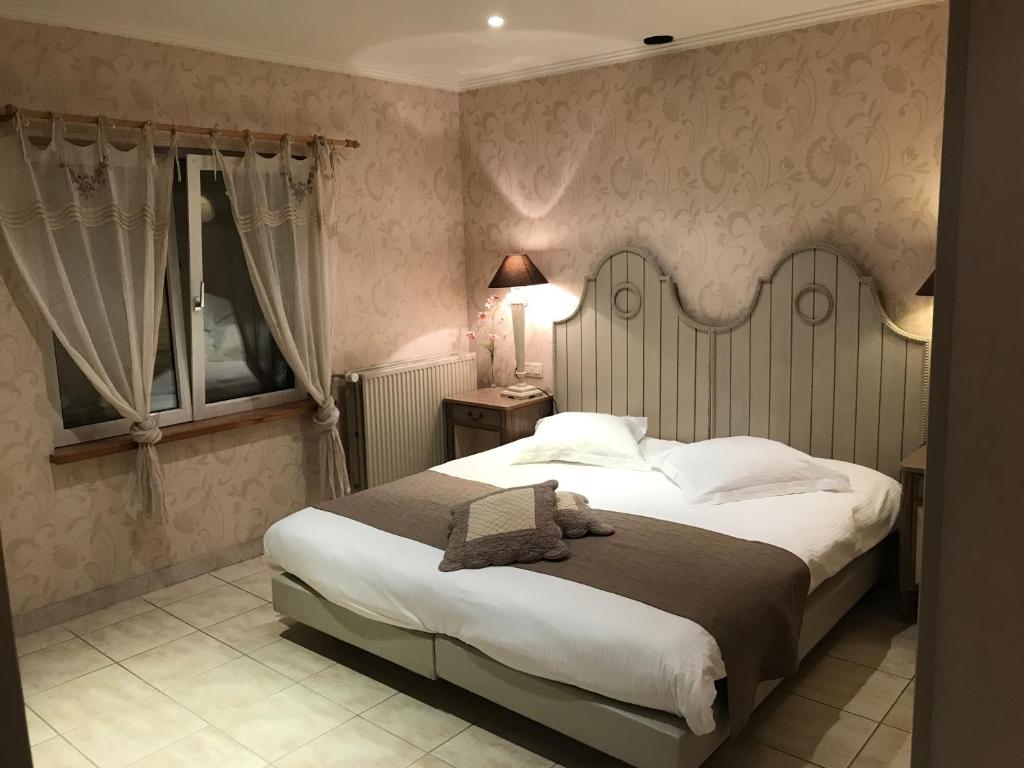 Postel nebo postele na pokoji v ubytování Hotel Cosy Bouillon