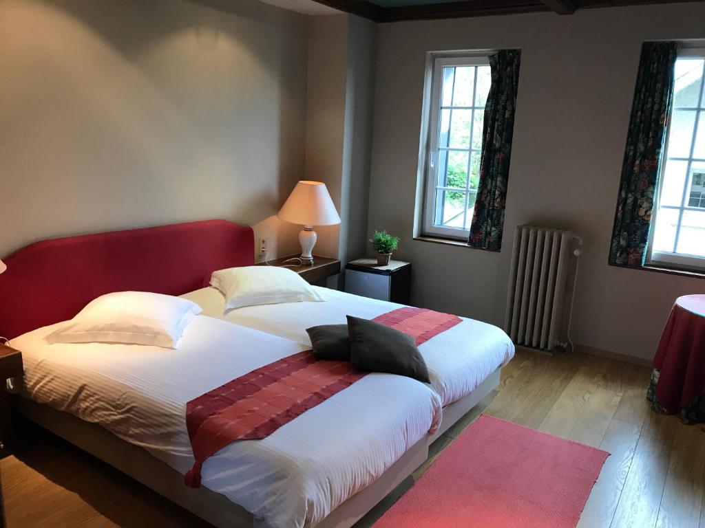 Postel nebo postele na pokoji v ubytování Hotel Cosy Bouillon