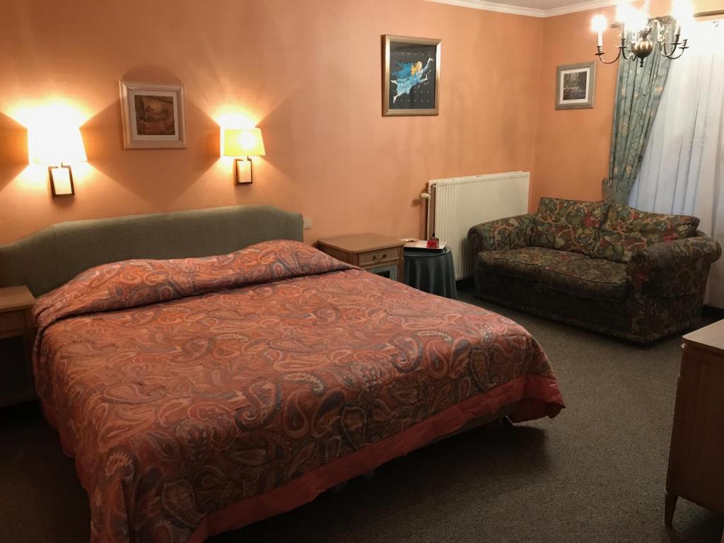 Postel nebo postele na pokoji v ubytování Hotel Cosy Bouillon