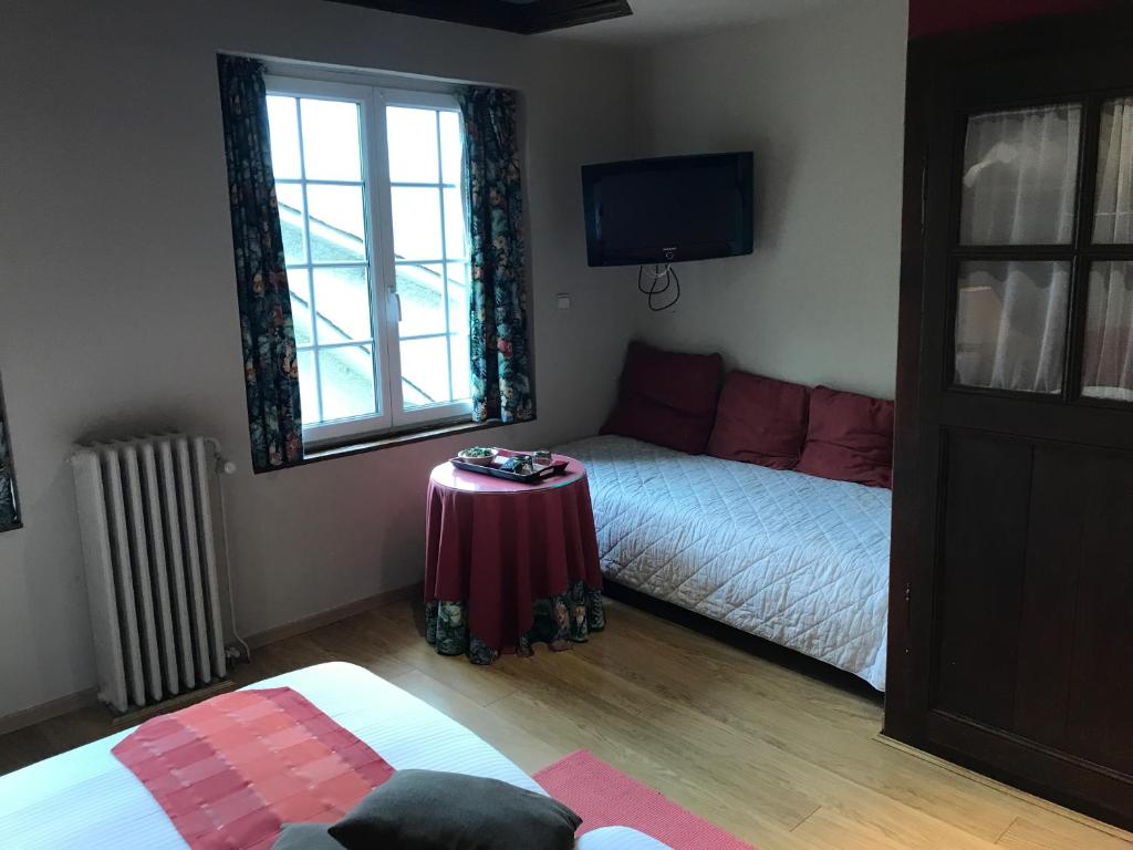 Postel nebo postele na pokoji v ubytování Hotel Cosy Bouillon