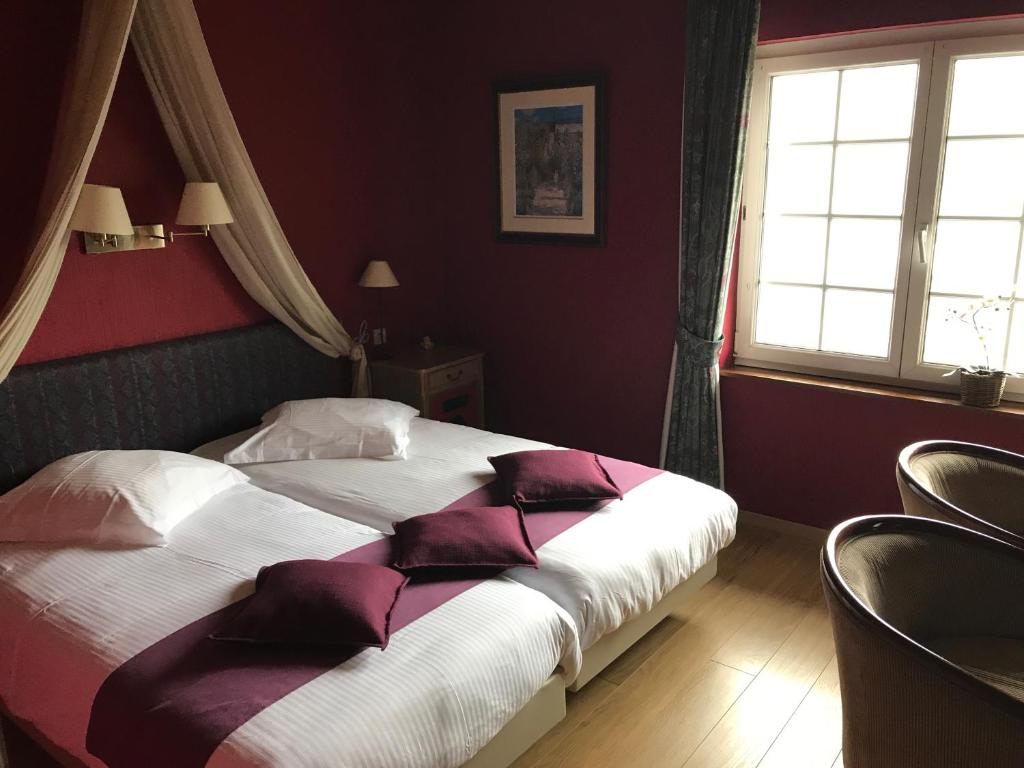 Postel nebo postele na pokoji v ubytování Hotel Cosy Bouillon