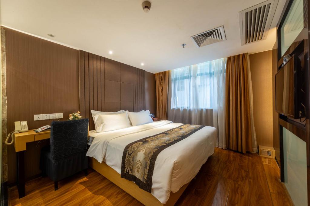 Postel nebo postele na pokoji v ubytování XW Hotel