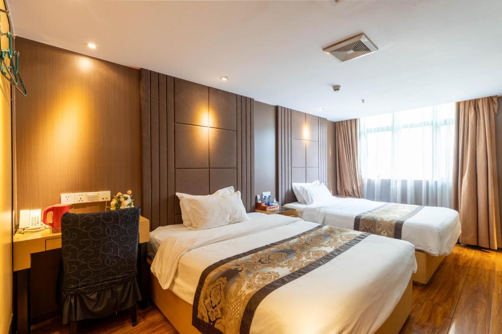 Postel nebo postele na pokoji v ubytování XW Hotel
