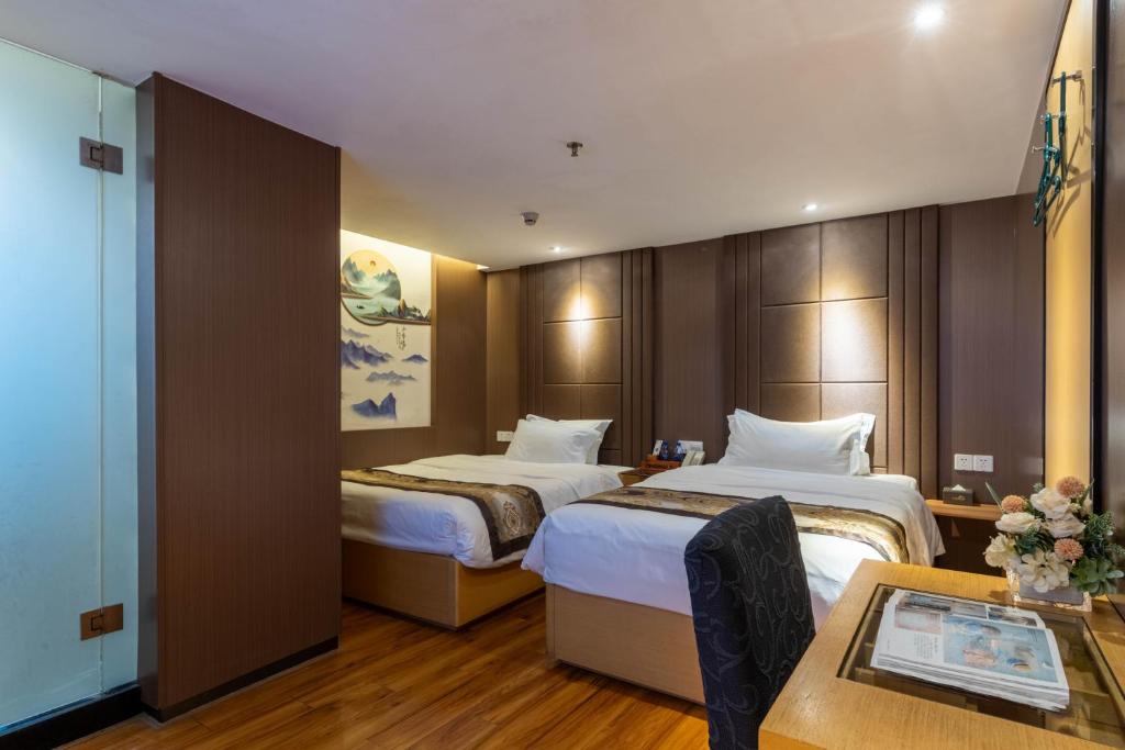 Postel nebo postele na pokoji v ubytování XW Hotel