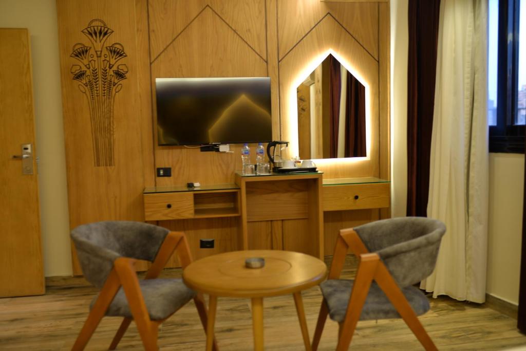 Kuchyň nebo kuchyňský kout v ubytování Neom Pyramids Valley Boutique hotel