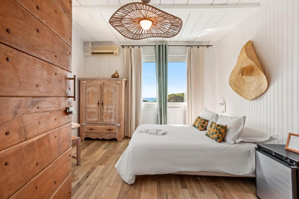 Ένα ή περισσότερα κρεβάτια σε δωμάτιο στο Villa Paradis