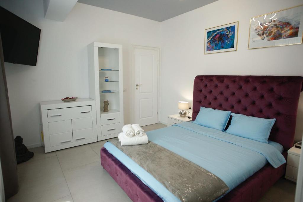 Giường trong phòng chung tại Happy 2 Family Lamera Residence