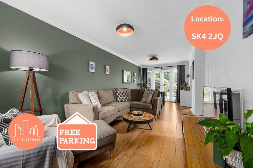 a living room with a couch and a table at 3 Bed Stockport Home by City SuperHost in Manchester
