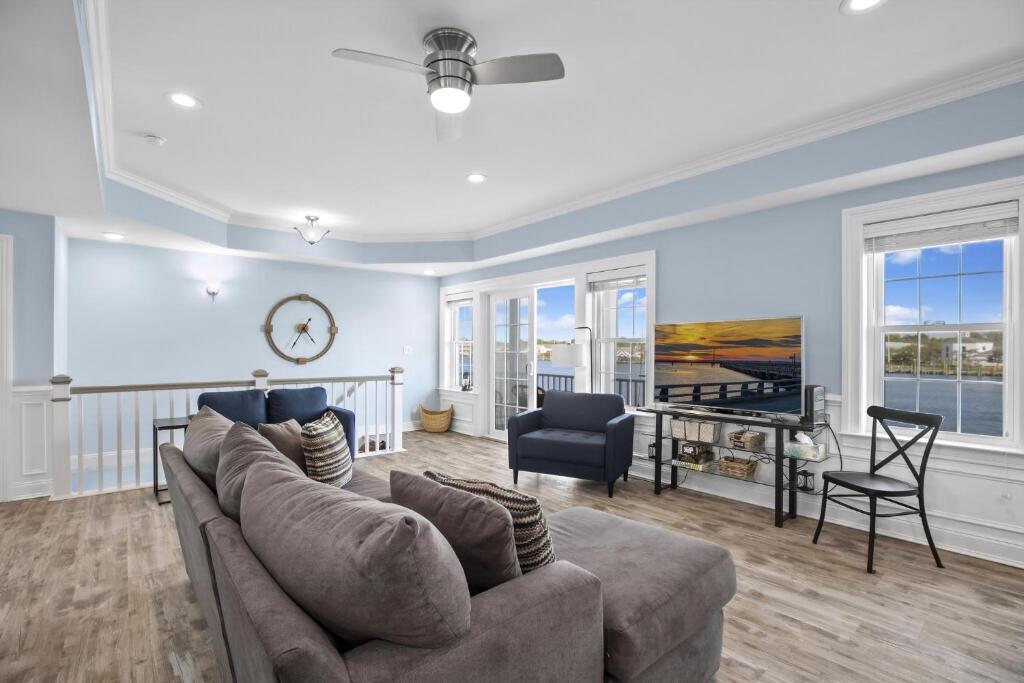 a living room with a couch and a table at At The Waters Edge in Chincoteague