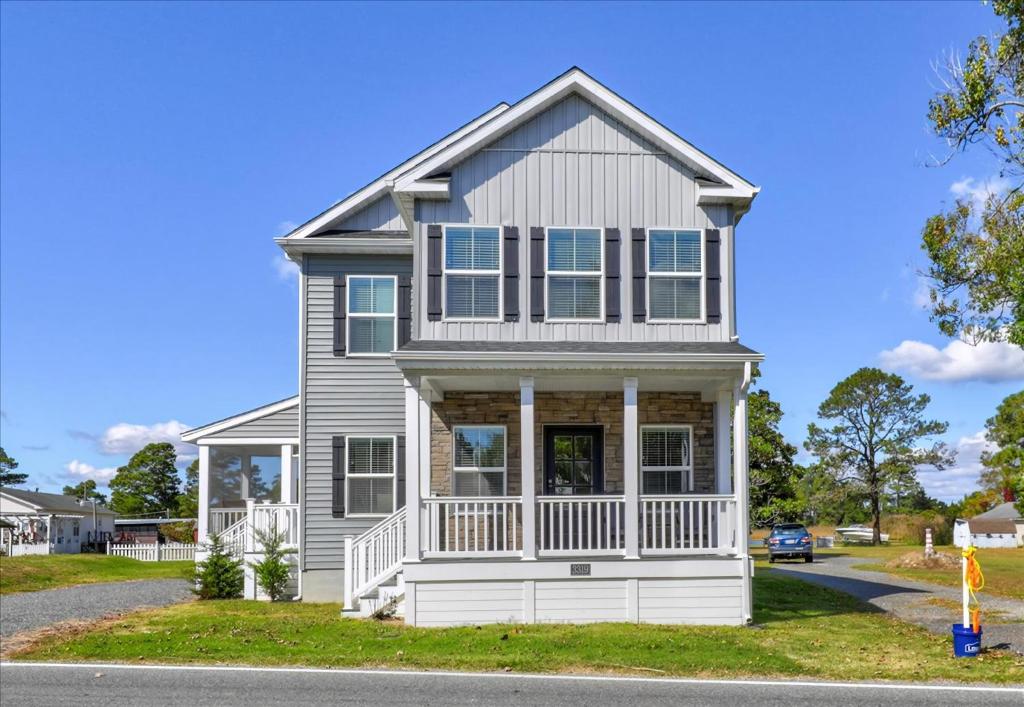 a house with a white house at Saltwater Pony in Black Point Landing