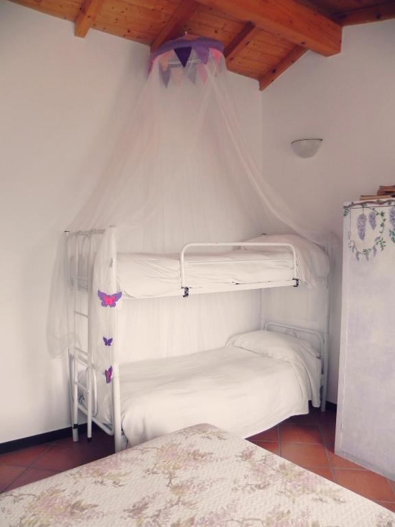 A bed or beds in a room at B&B I Glicini