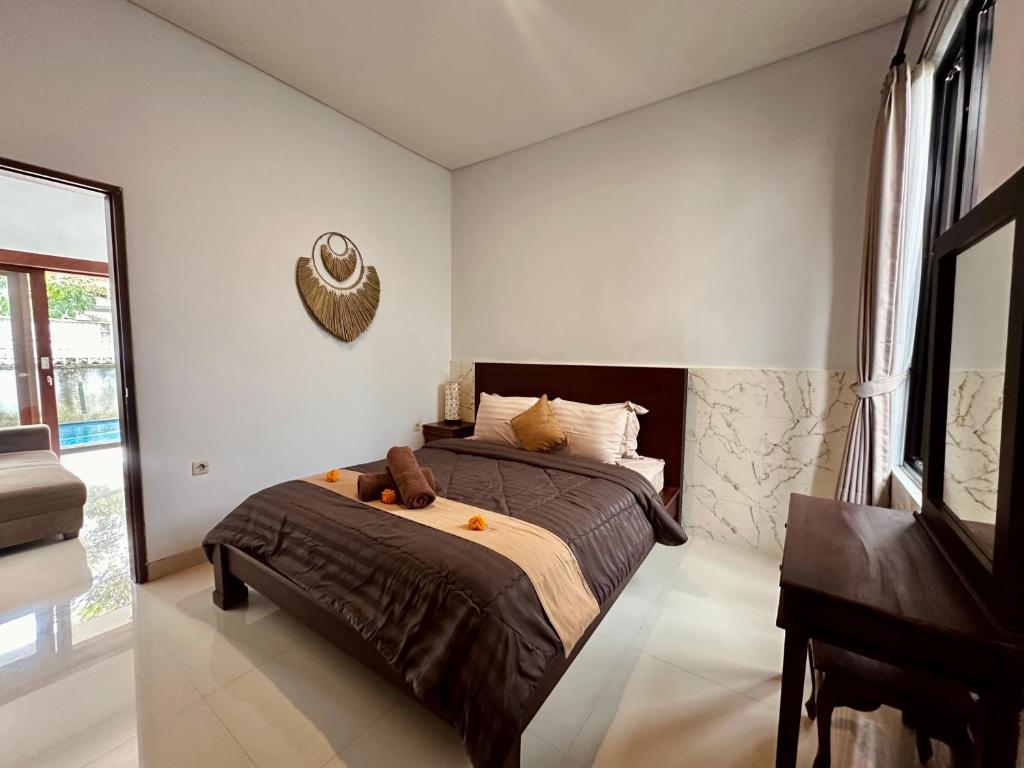 Postel nebo postele na pokoji v ubytování Kanda Villa