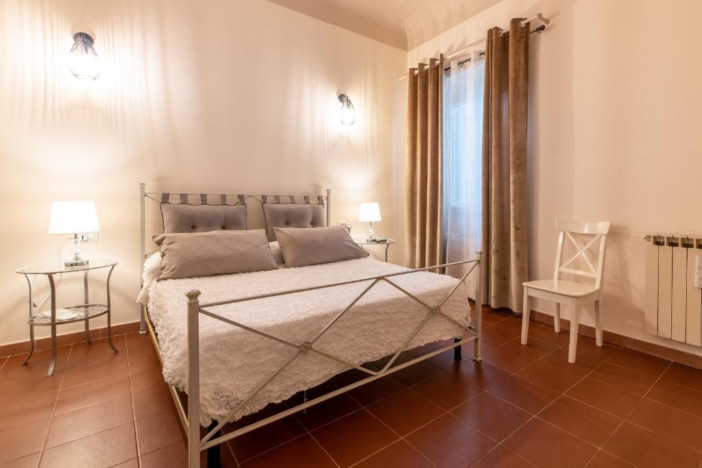Postel nebo postele na pokoji v ubytování Dante Experience Apartment