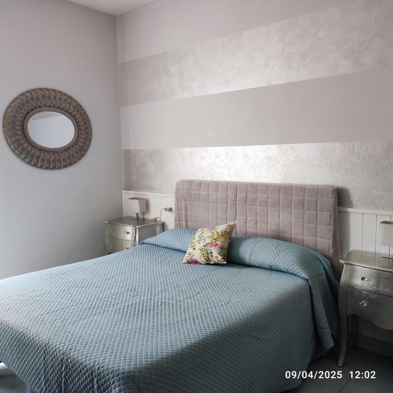 Postel nebo postele na pokoji v ubytování Casapatrizia B&B Sirmione